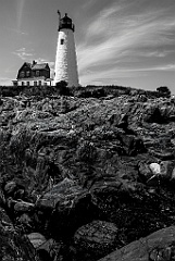 Wood Island Lighthouse on Rocky Shore in Maine - BW